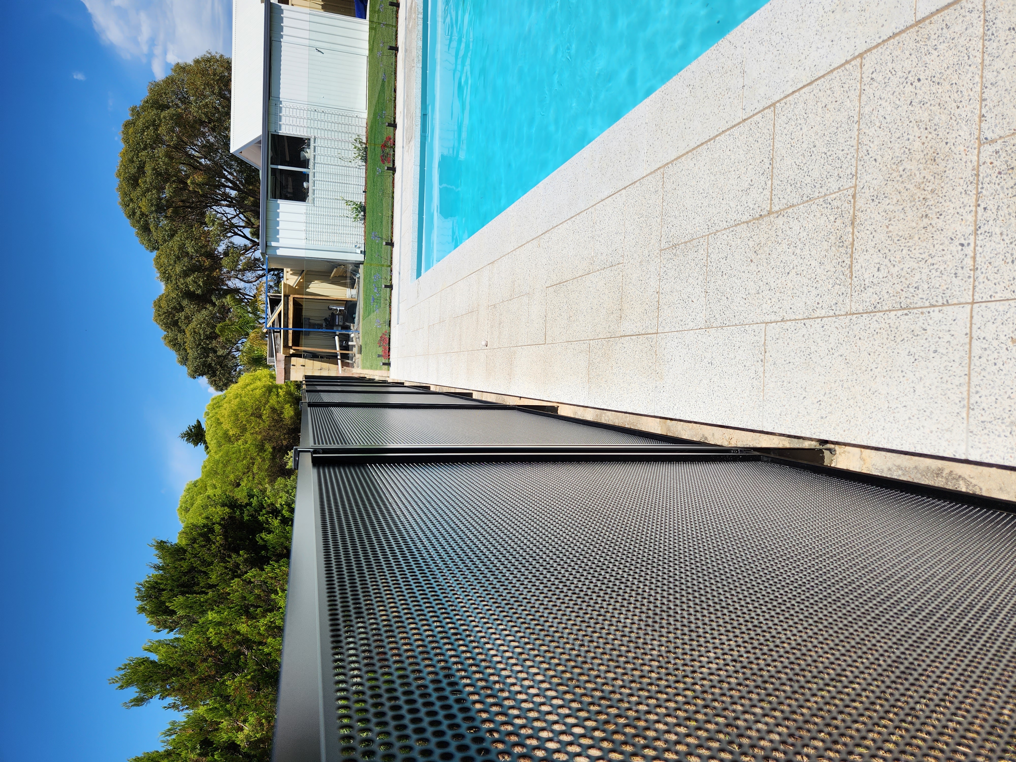 Custom perforated aluminium pool fence designed and installed by Secure Fit Fencing, Perth WA