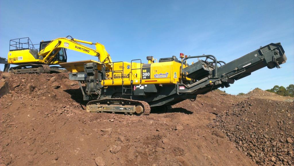 Excavator and crusher on site