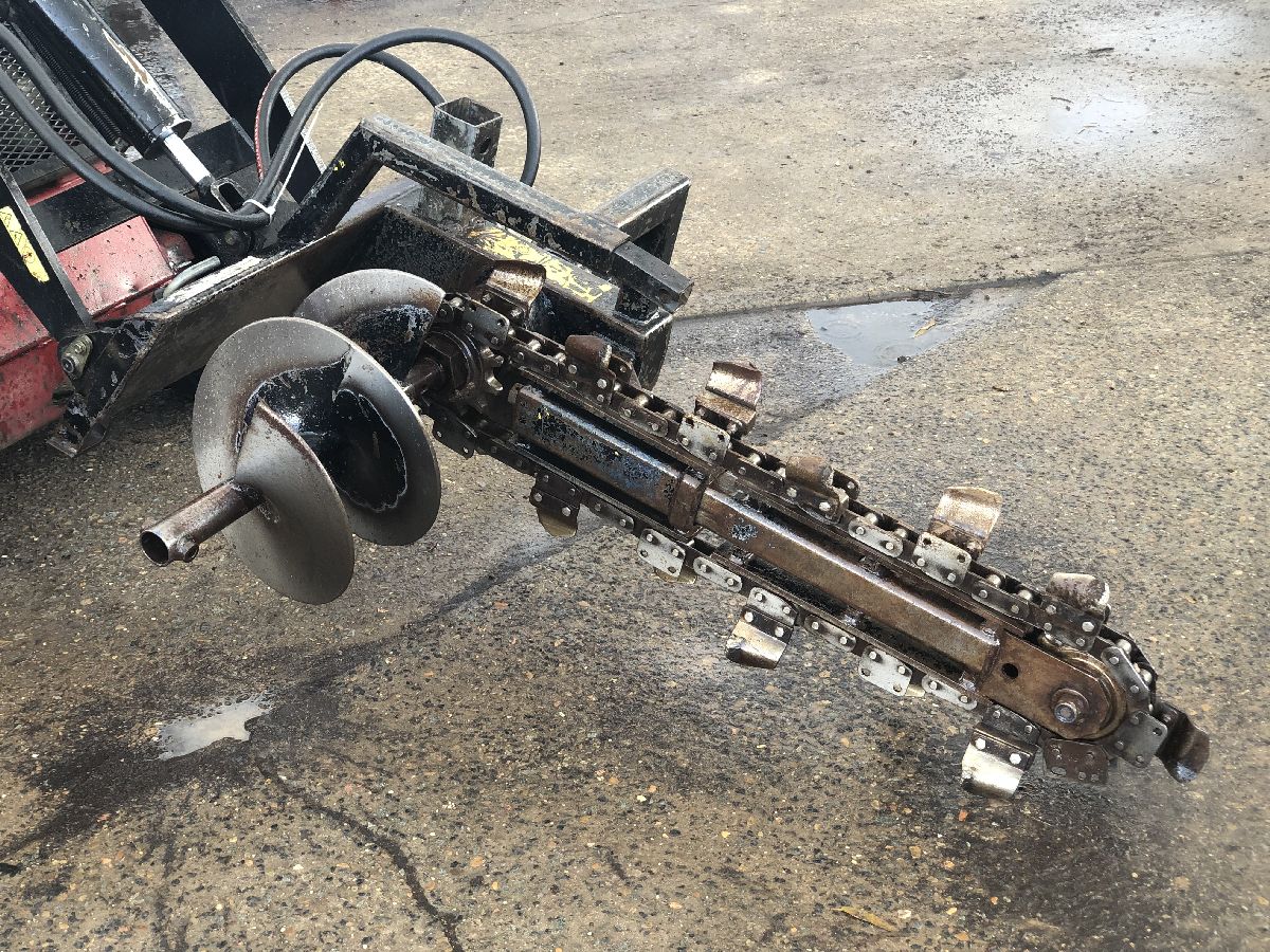 At Online Hire we hire mini skid steer loaders; this image shows a trencher attachment