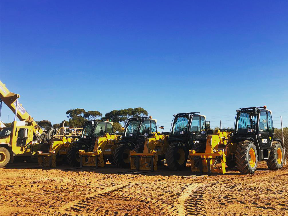 Yellow Hire Smaller Excavator Kubota on Trailer front